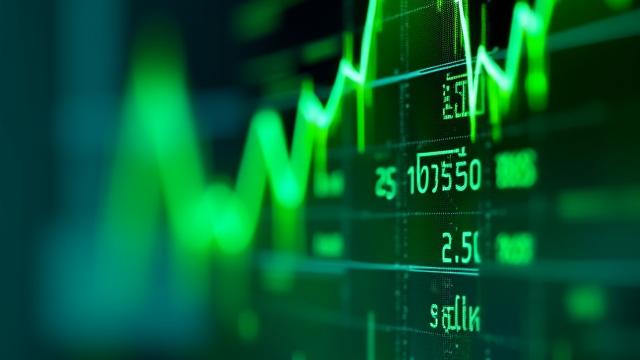 A stock market ticker displaying green upward trends, reflecting positive market news.